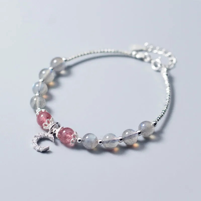 Natural moonstone adjustable bracelet with crescent moon charm and crystal accent on wrist