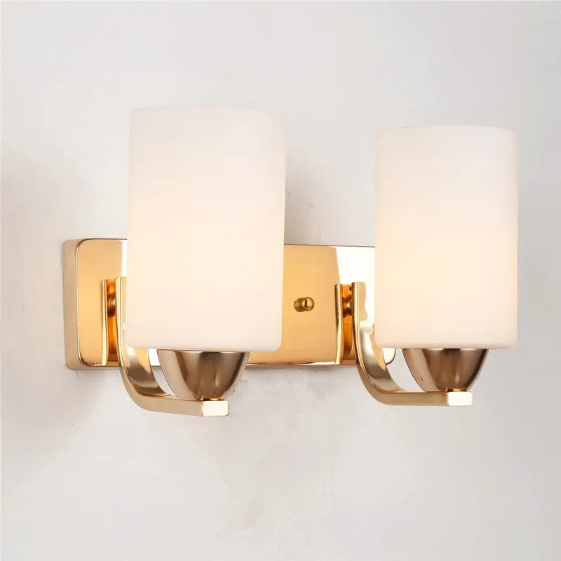 Chrome electroplated wall lamp with glass shade showing single head bedside lighting fixture
