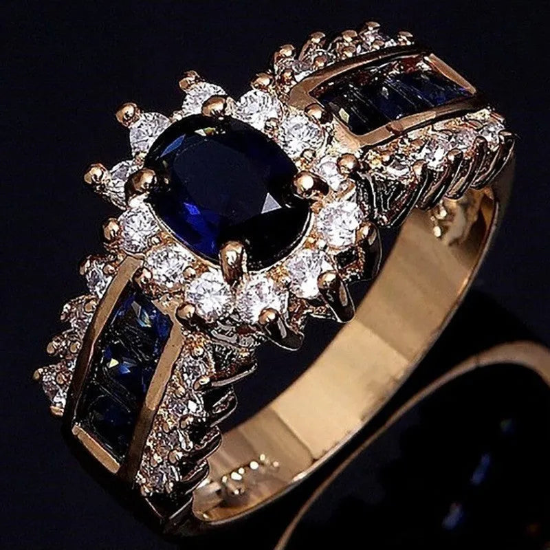 Personalised zinc alloy ring with blue diamond or coloured zircon designs in sizes 6 to 11.