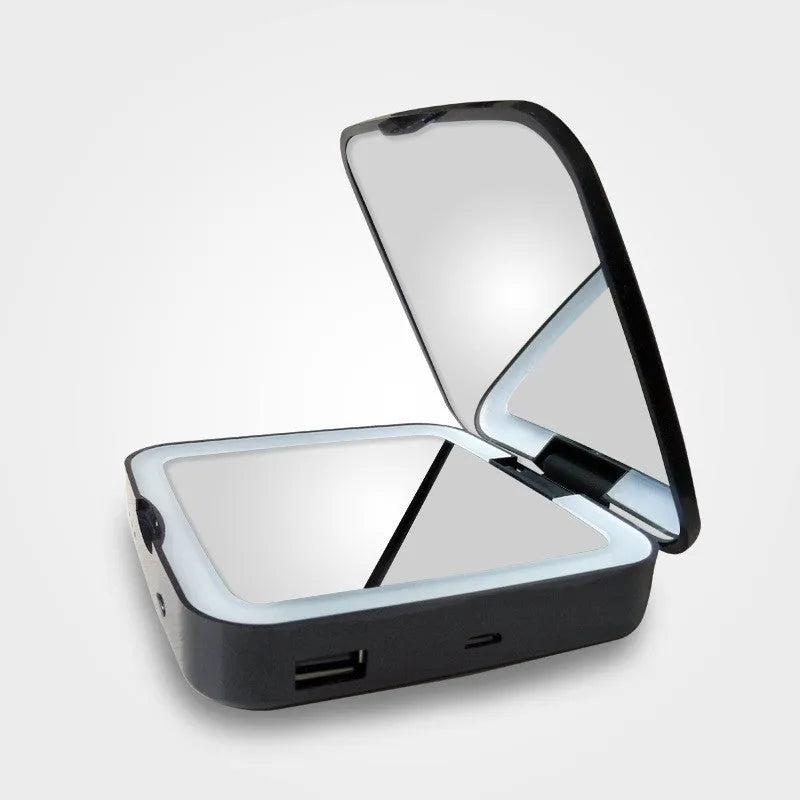 Dual-sided makeup mirror showing 4x magnification side and adjustable lighting controls in black finish