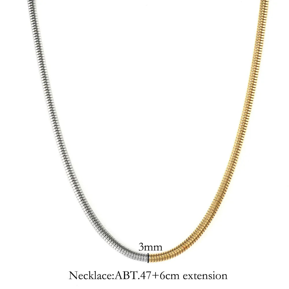 Gold-coloured stainless steel snake bone chain necklace with geometric shapes for women.