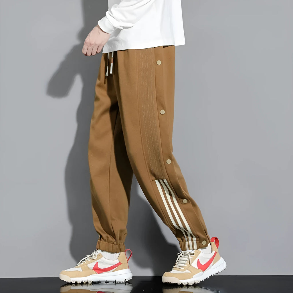 Men's black loose sports sweatpants with ankle ties and elastic high waist