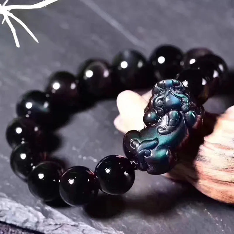 Natural ice colour eye obsidian crystal bracelet on wrist showing bead size.