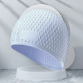 Adult silicone swimming cap in water drop design showing multiple colour options