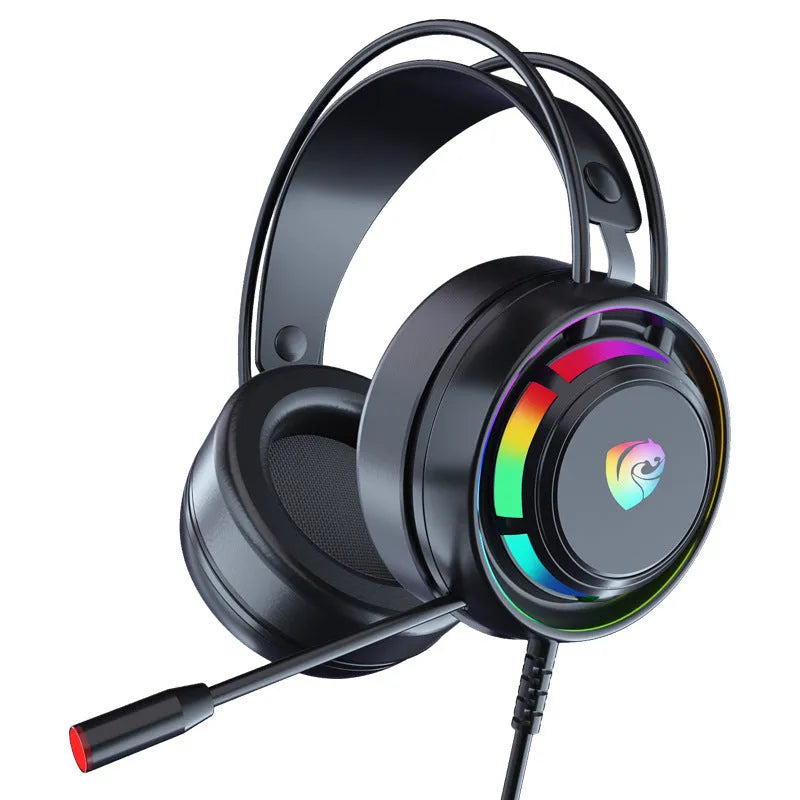 Black wired over-ear computer headphones with microphone and long cable on a desk