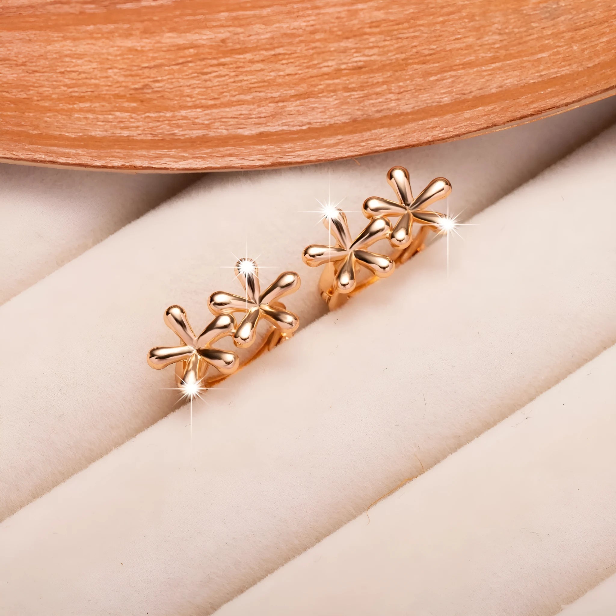 Rose gold electroplated earrings with circular waterdrop flower design