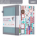 A5 notebook with PU cover, open to show no-date strap and thread binding, with planning stickers.