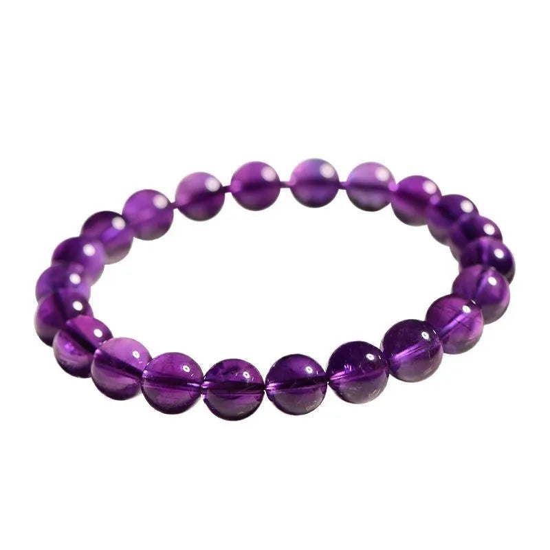 Natural Uruguayan amethyst crystal bracelet with round polished beads on a black stretch cord.