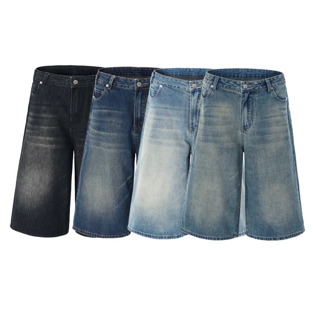 Man wearing loose straight-leg cotton denim shorts in a summer casual setting.