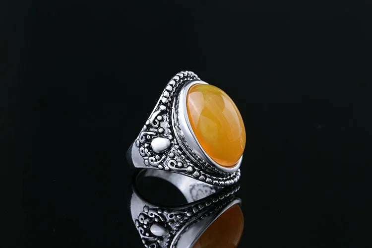 Retro geometric alloy ring with antique silver amber electroplating showing fluorescent beeswax elements