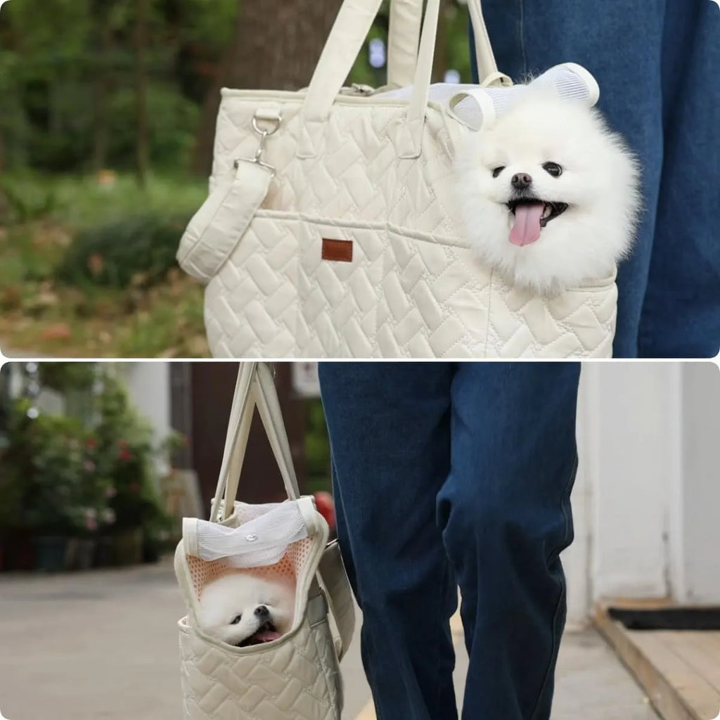 Grey pet carrier handbag with mesh panels and a safety tether for a small dog.