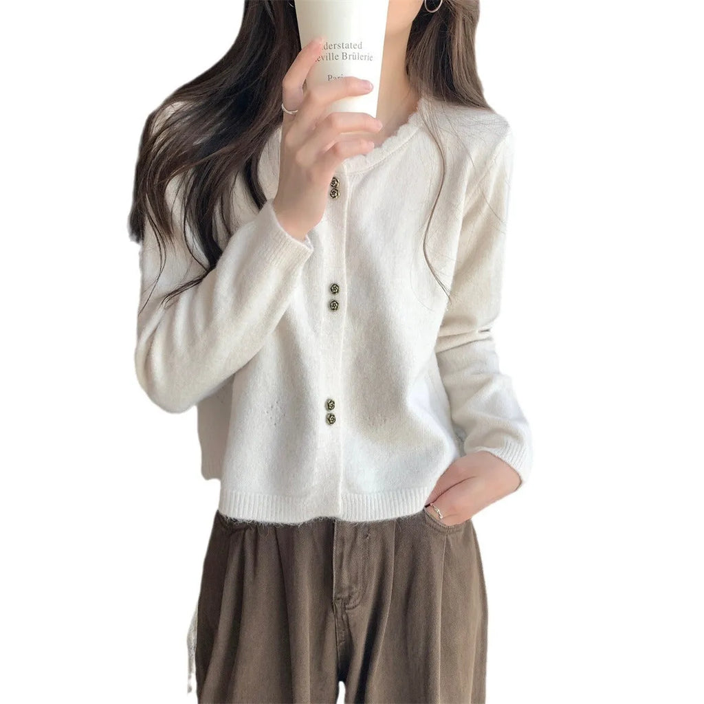 Women's acrylic cardigan sweater coat in milky white, shown with long sleeves and a cardigan front.