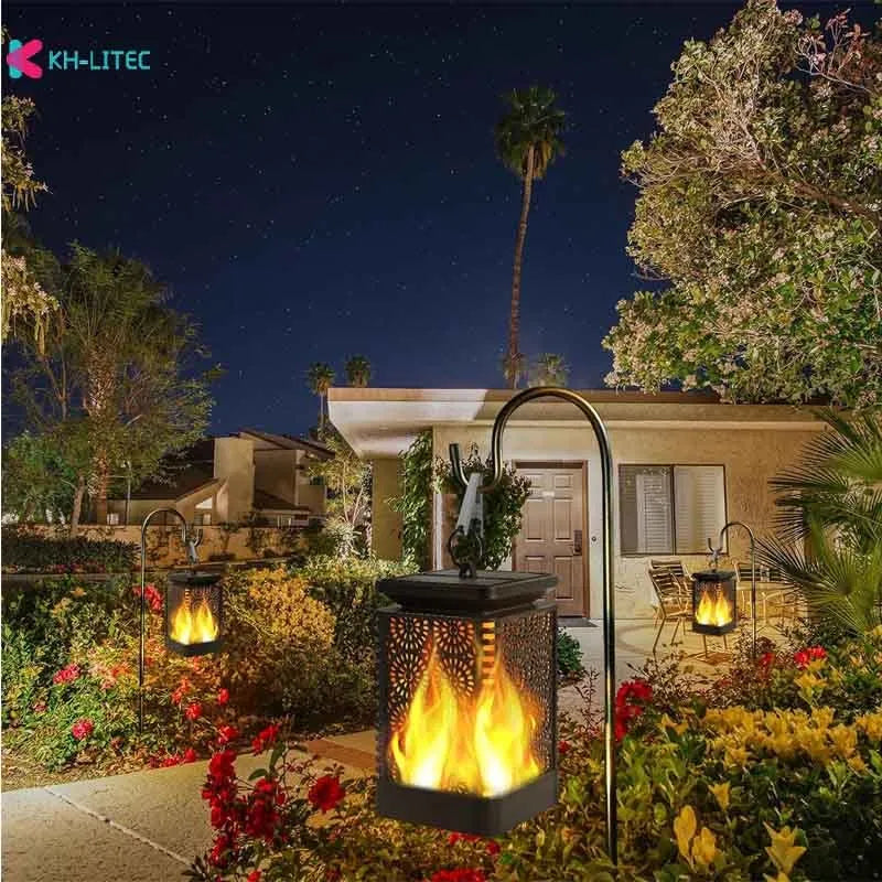 Set of four black solar-powered garden lanterns with flickering flame LED effect