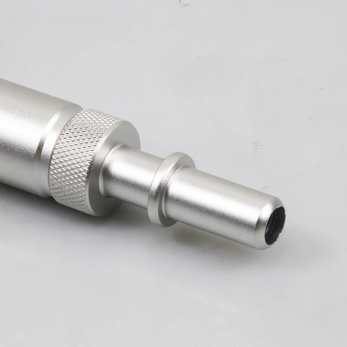 Silver metal transmission refuelling joint for VAS6262-9 diagnostic equipment.