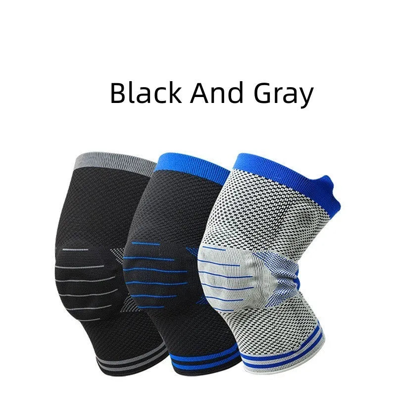 A black and grey cotton knee pad showing a silicone massage spring bar shock absorber on the knee area.