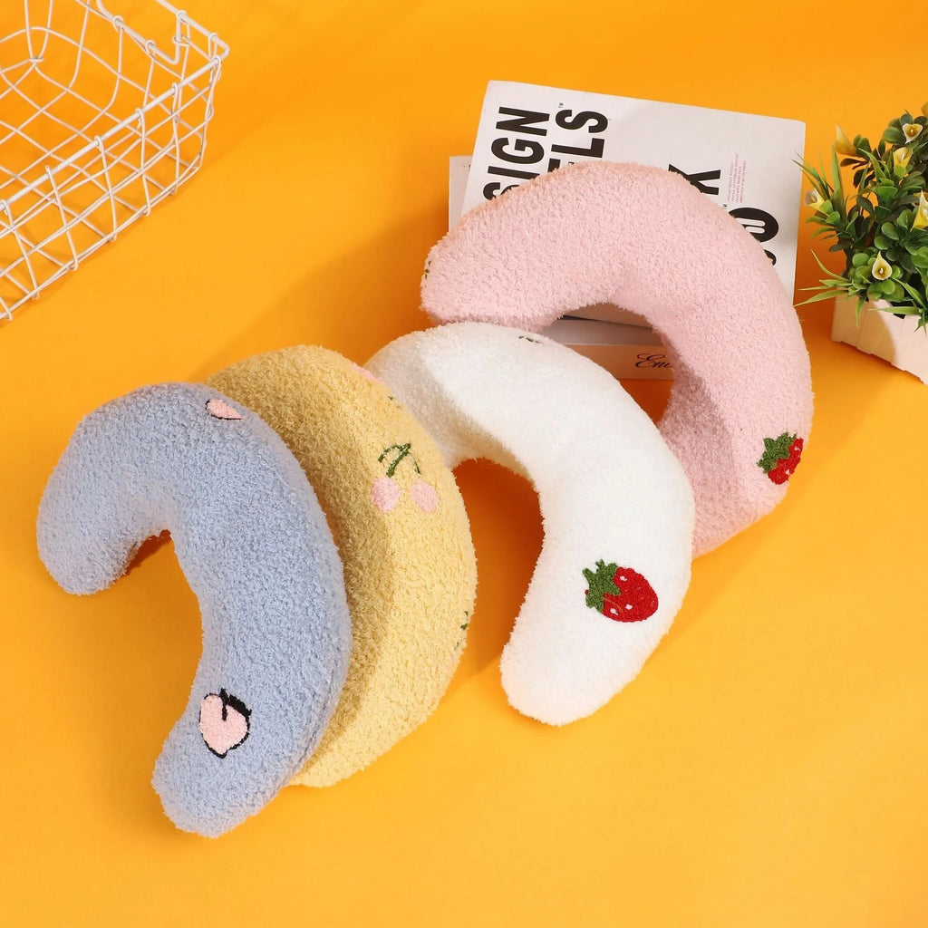 Colourful half moon U-shaped cloth pillow for cats and small dogs to sleep on.