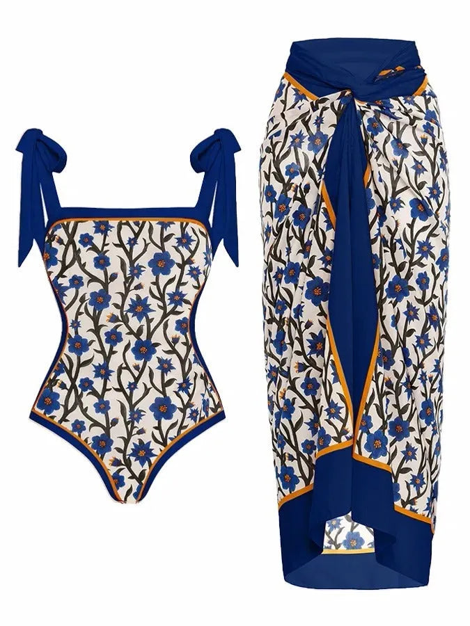 Women's printed two-piece swimsuit with a flowy chiffon skirt in a floral pattern design.