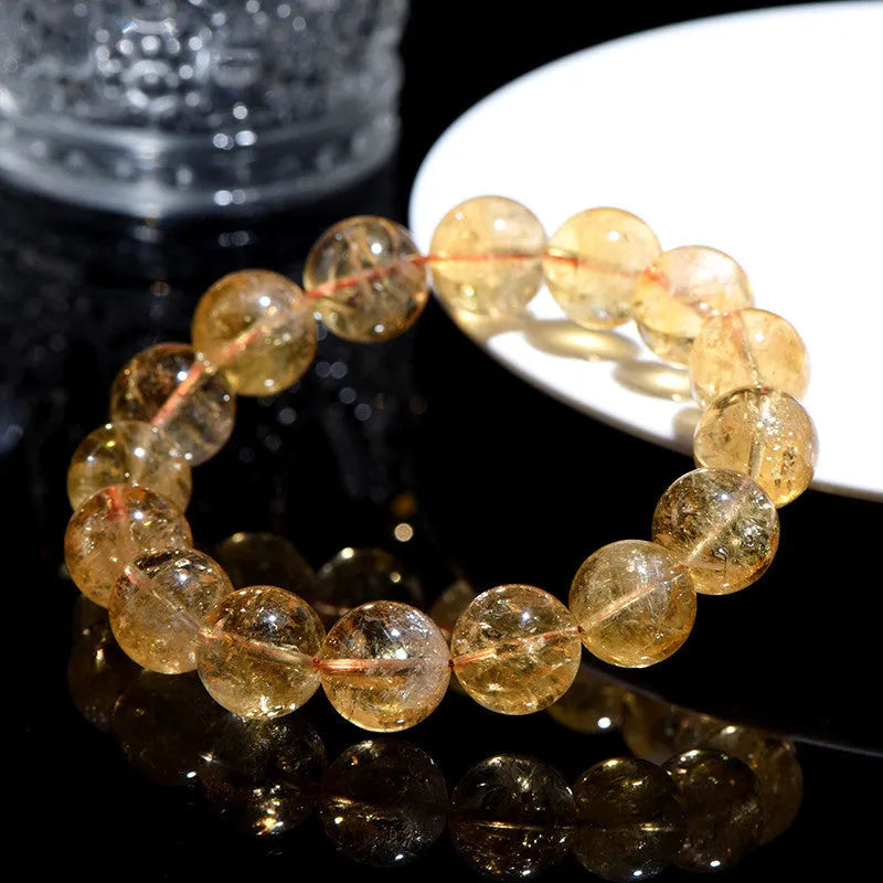 Natural yellow citrine bead bracelet showing options for single strand and triple strand styles.