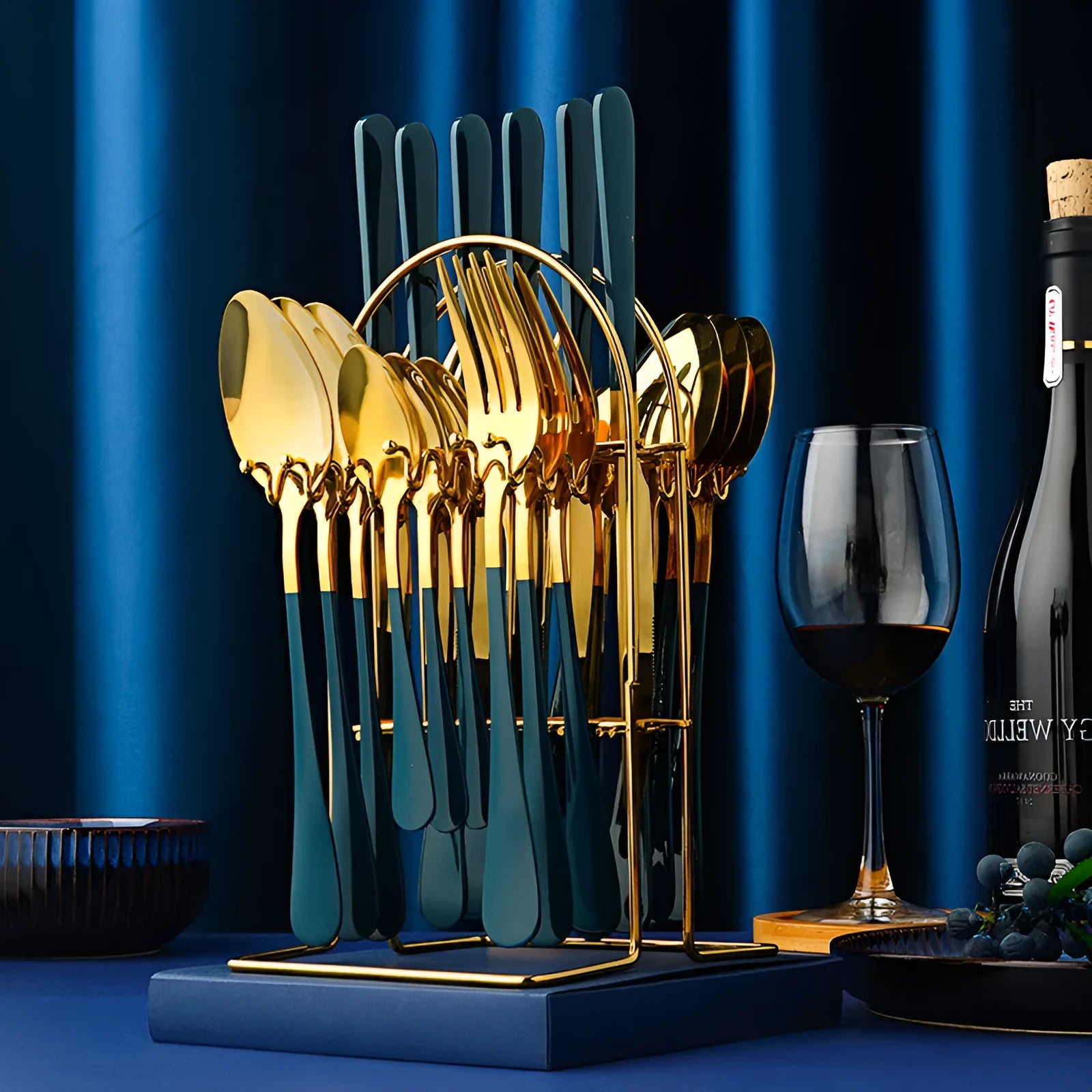 Gold stainless steel 24 piece dinnerware set with storage rack knife fork spoon on white background