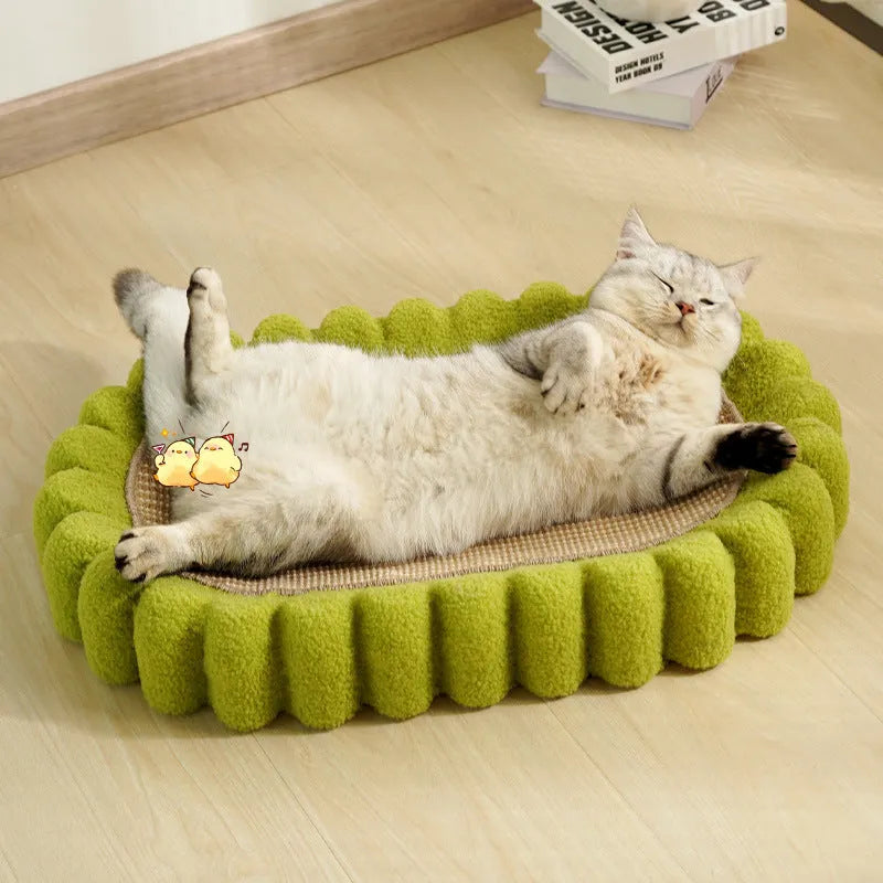 Green oval-shaped cat scratch pad and lounge bed made from textured sisal fabric.