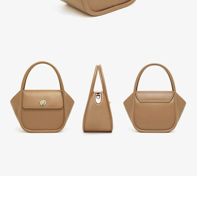 Women's wing-shaped cow leather tote handbag with a buckle closure in a choice of four colours.