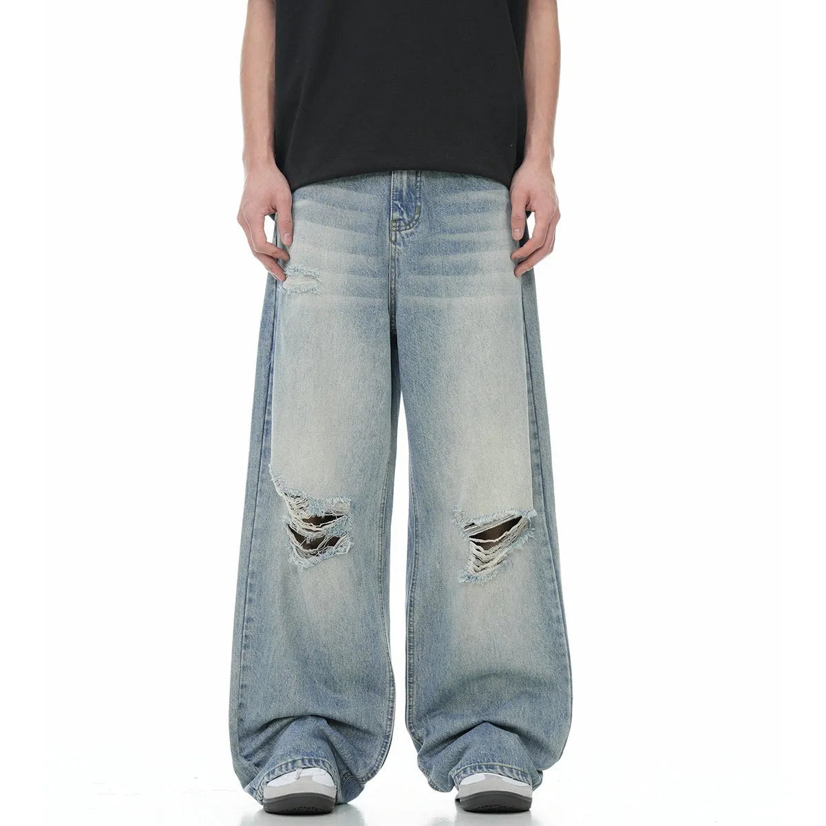 Blue men's straight-leg jeans with vintage rip detailing and zipper fly closure