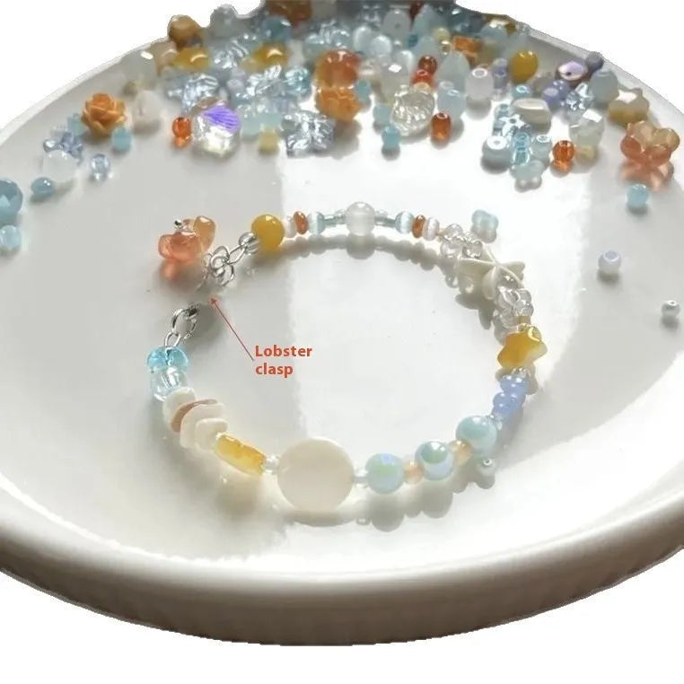 Orange alloy bracelet with diamond shape and round mixed material elements