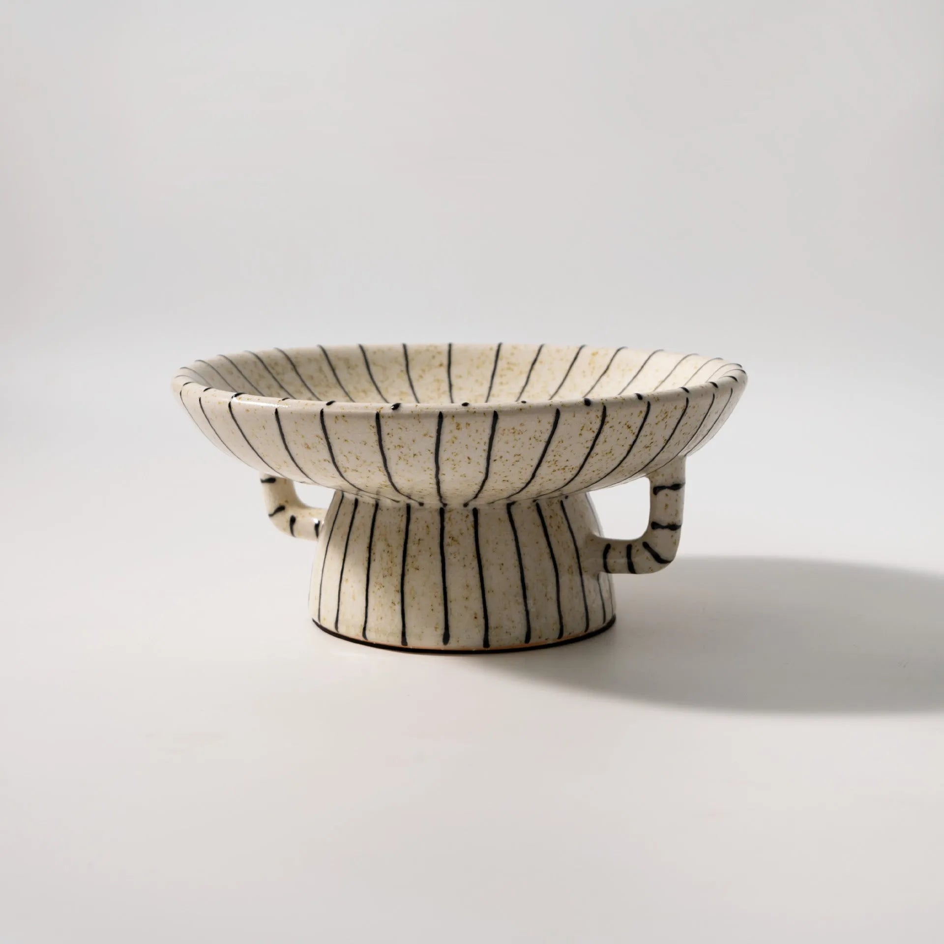 Black and white striped synthetic resin fruit plate with retro geometric pattern