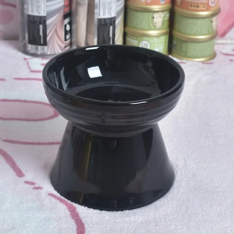 Ceramic anti-tumble pet bowl for dogs and cats with high foot and neck protector.