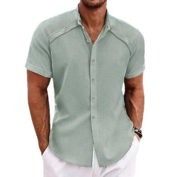 Hawaiian casual short sleeve solid colour shirt in cotton blend fabric, showing collage stitching details, available in multiple colours like Navy Blue