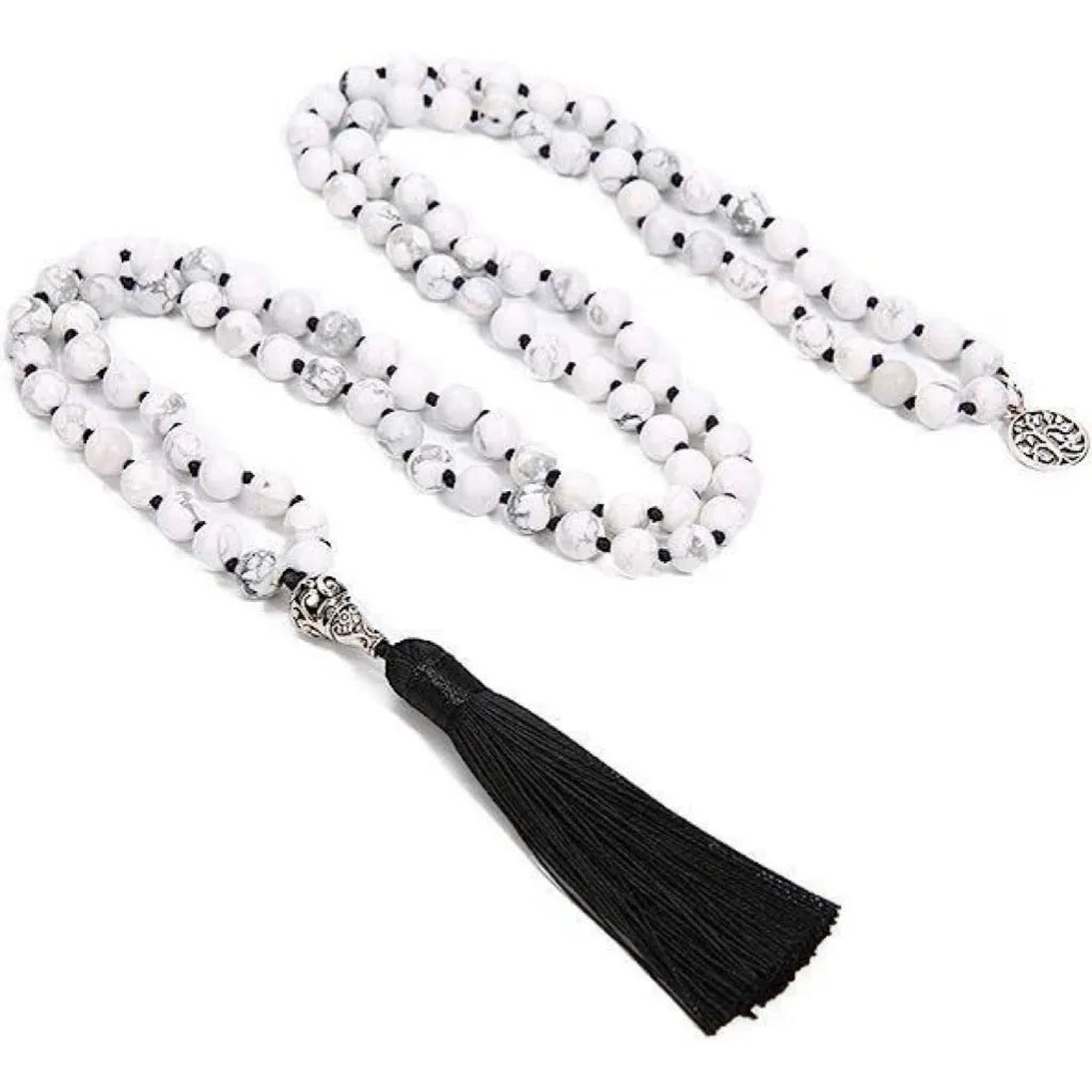 Handmade knotted beaded necklace with 108 natural stone beads in a simple geometric style on a white background