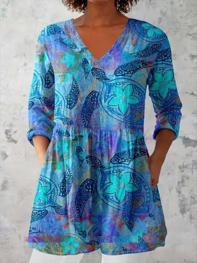 Women's retro-style slim fit long-sleeved top with a printed pattern, shown in one of twelve available colours.