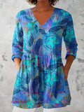 Women's retro-style slim fit long-sleeved top with a printed pattern, shown in one of twelve available colours.
