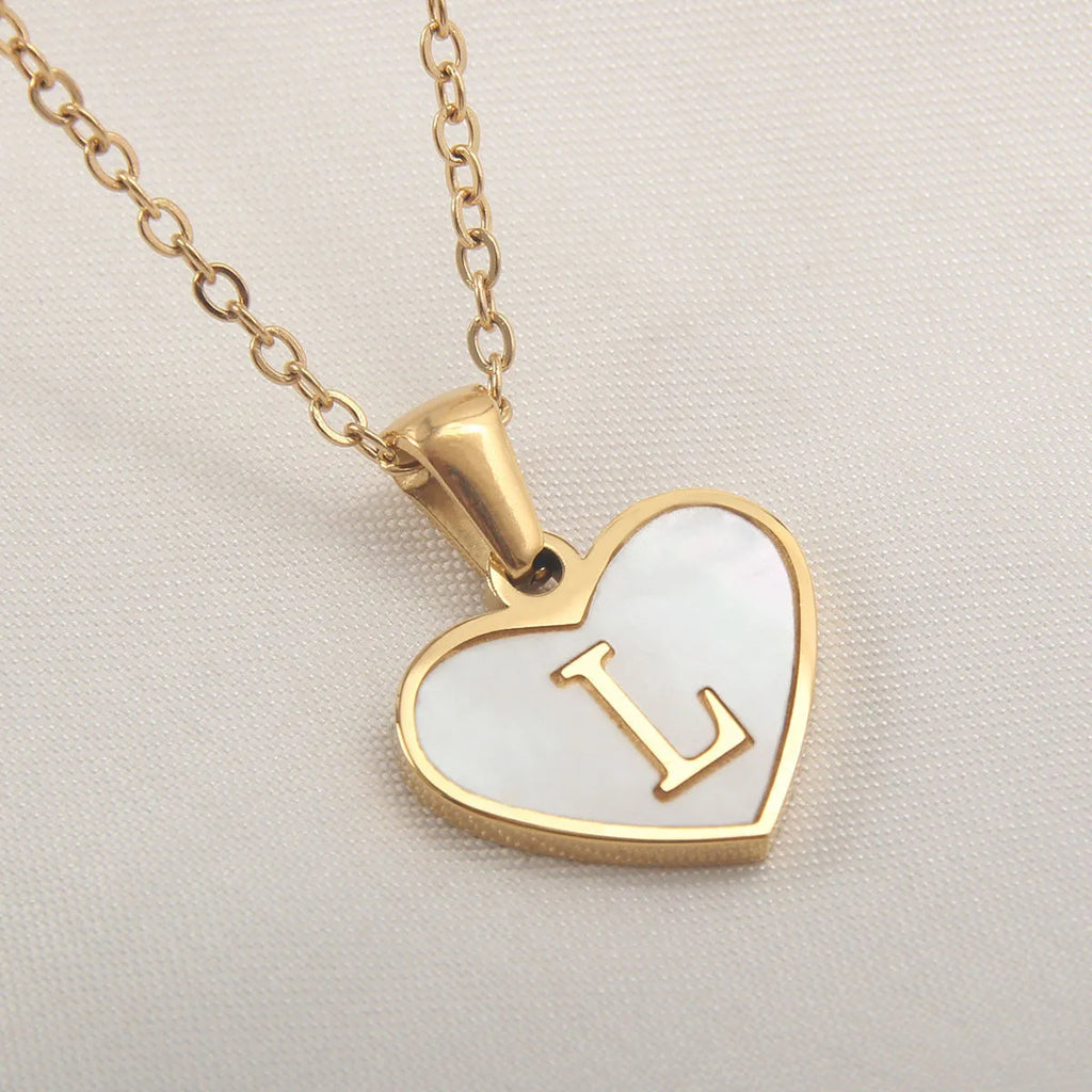 Gold heart necklace with white shell centre on stainless steel chain