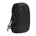 Army green waterproof rain cover for a large 80 litre backpack on a hiking trail.