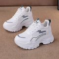 Women's white breathable dad shoes with cross straps and a height-increasing insole, shown with laces.