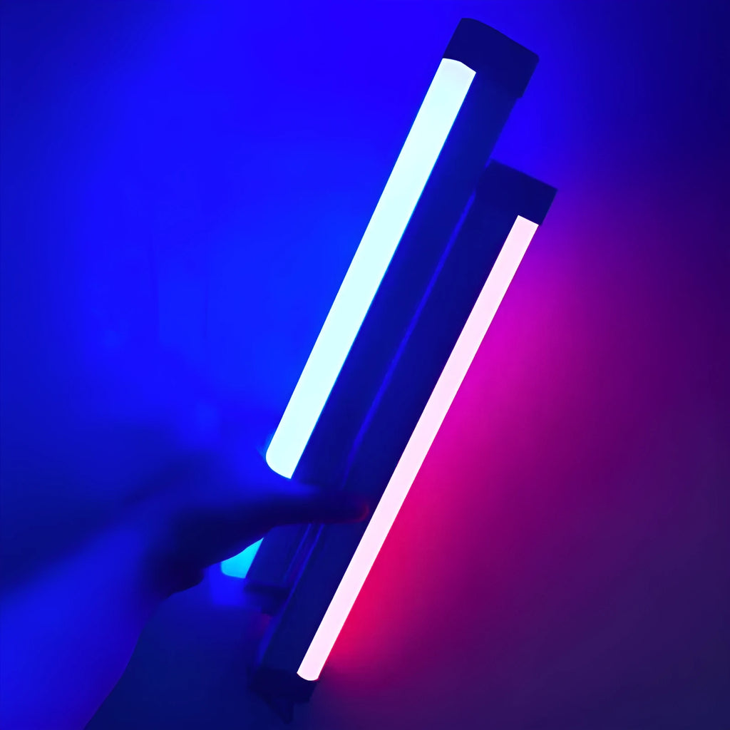 Blue and purple rechargeable LED tube stick light resting on a surface, showcasing its slim design.