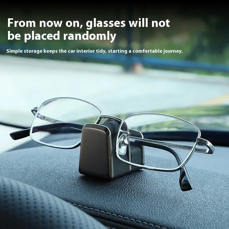 Green zinc alloy and leather glasses clip holder for car dashboard.
