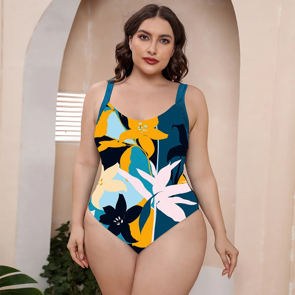 Floral print one-piece swimsuit with spaghetti straps on a mannequin.