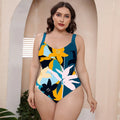 Floral print one-piece swimsuit with spaghetti straps on a mannequin.