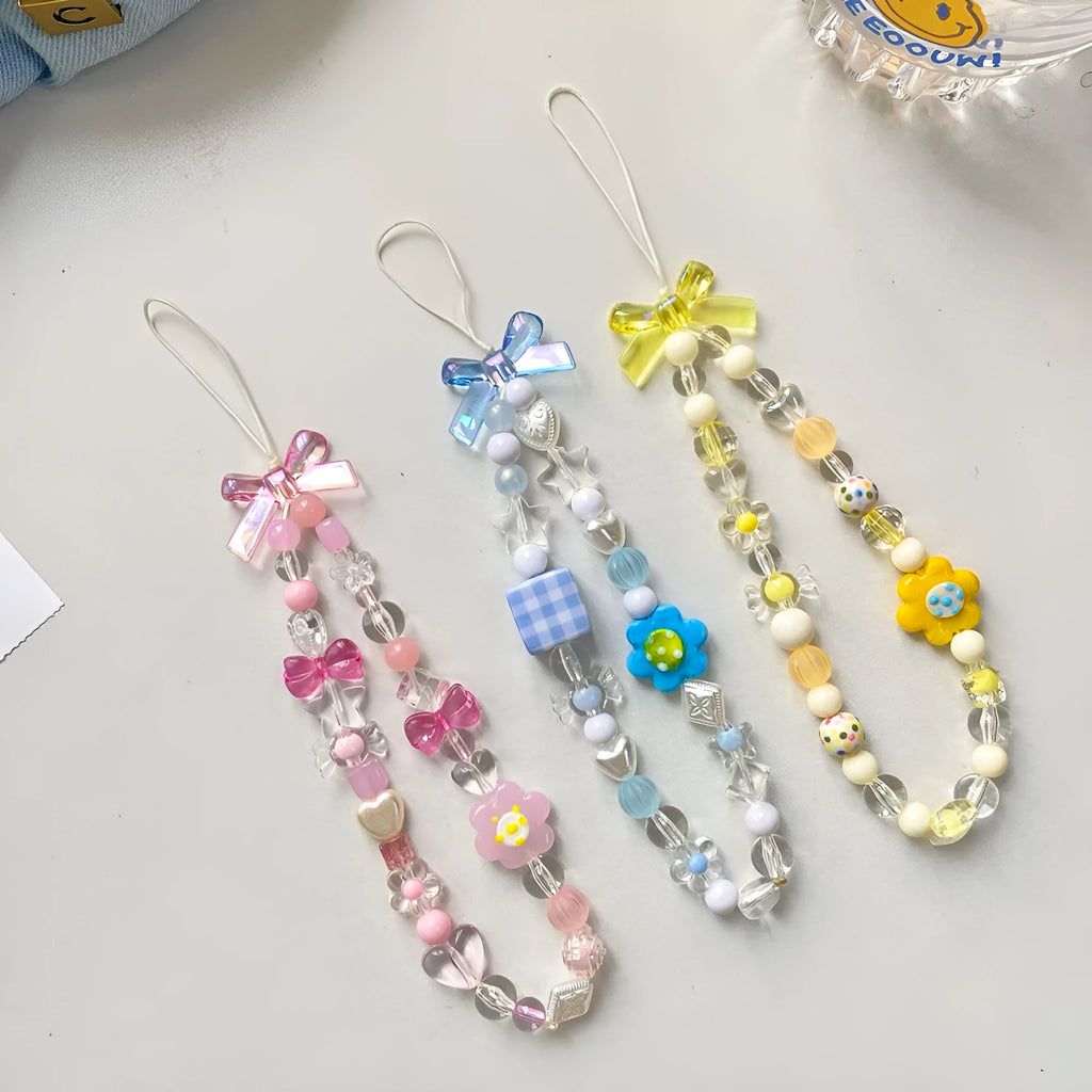 Plastic beaded mobile phone lanyard with floral charms in blue, pink or yellow colour options