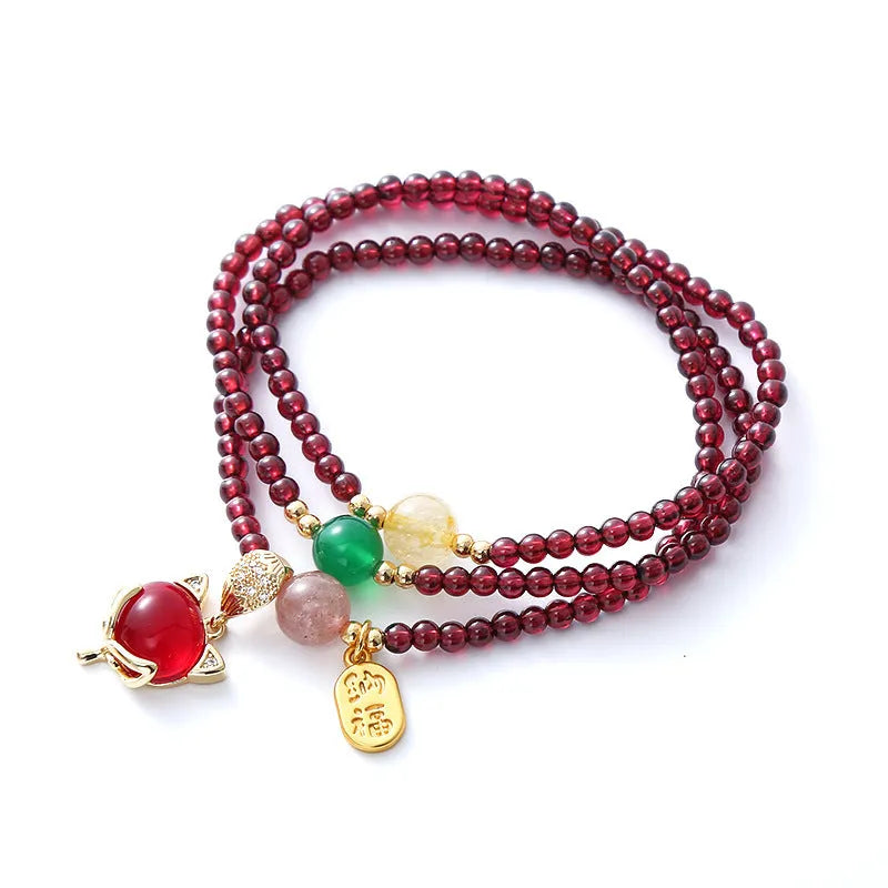 Natural crystal fox bracelet for women with purplish red garnet pendant on adjustable rope
