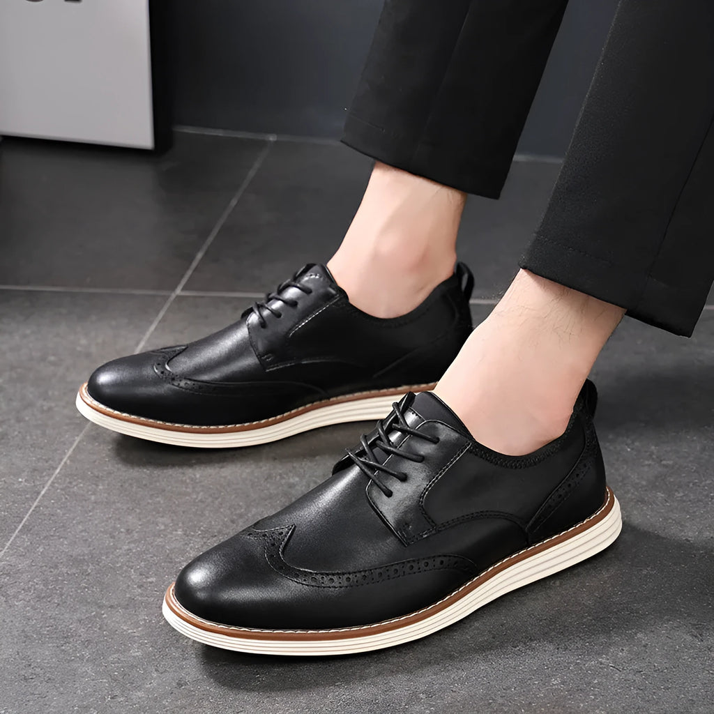 Men's black and brown slip-on business casual shoes with round toe and sculptured detailing