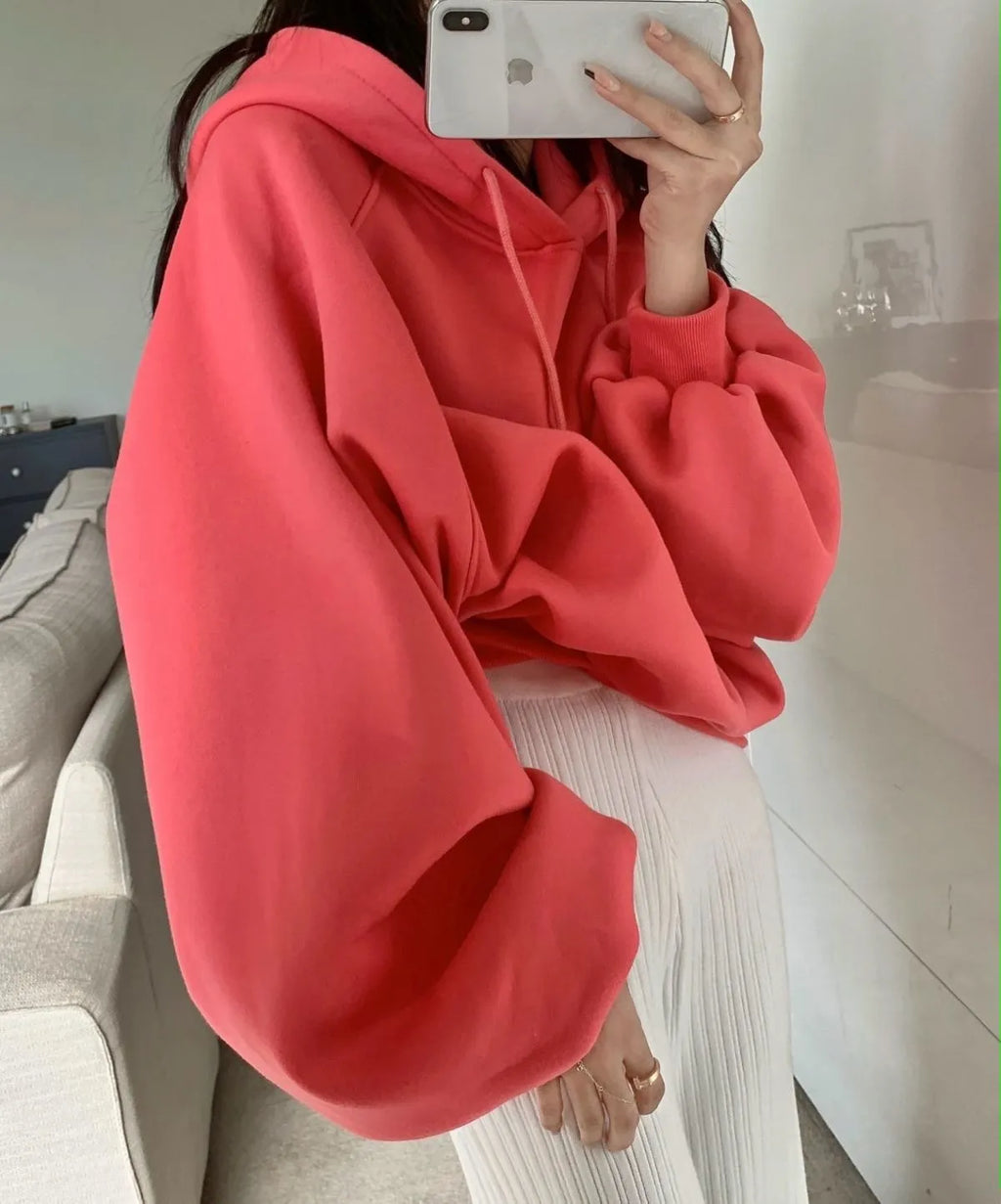 Watermelon red sleeveless women's hooded sweater made from mulberry silk, shown on a hanger.