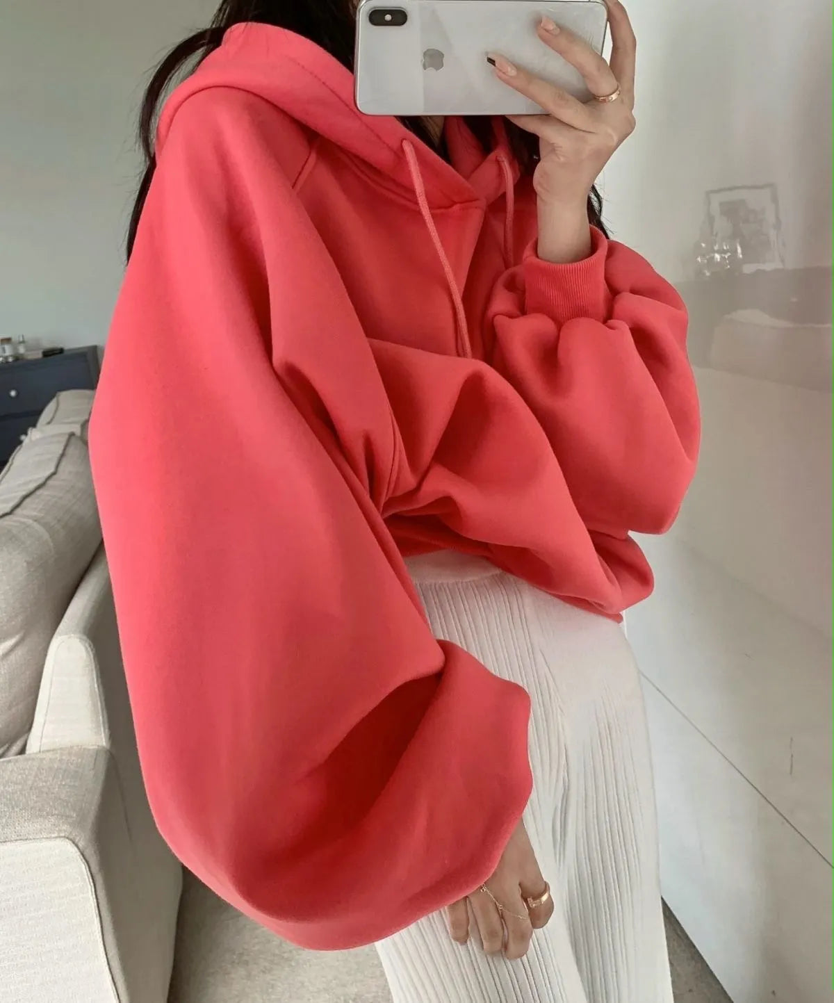 Watermelon red sleeveless women's hooded sweater made from mulberry silk, shown on a hanger.