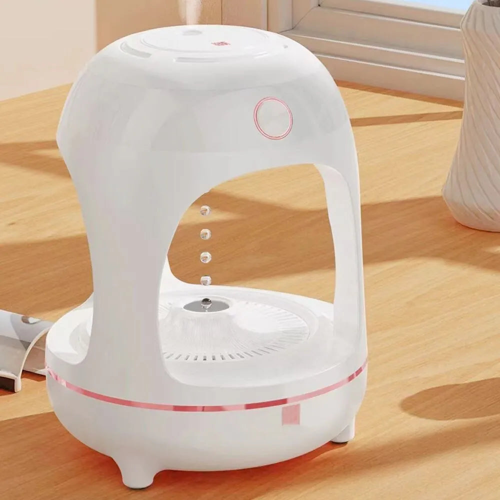 Anti gravity levitating water drops ultrasonic humidifier with LED night light in rose gold and white colour on a desk