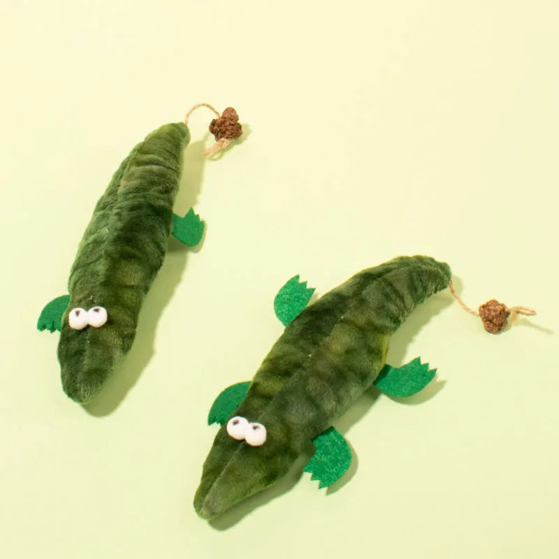Green plush alligator catnip toy with textured scales and long tail for feline play