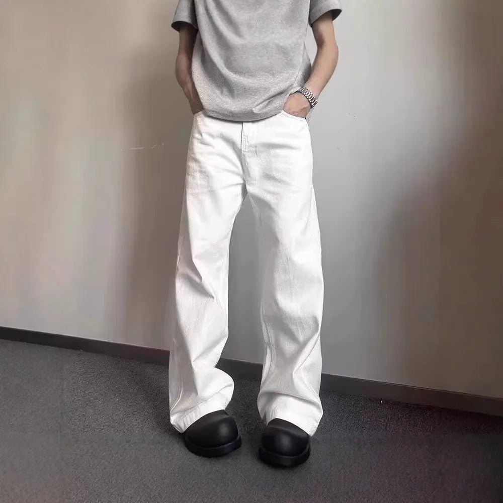 Men's white straight-leg wide fit cotton denim jeans on a neutral background.