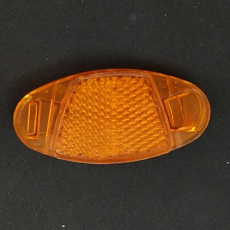 Plastic bicycle spoke reflector strips in white and yellow colours measuring 7.2cm long