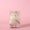A beige and a pink princess crown headdress for cats on a white background.